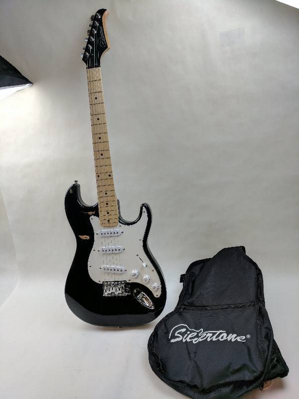 lot 35 image: Silvertone electric student guitar In Soft Case