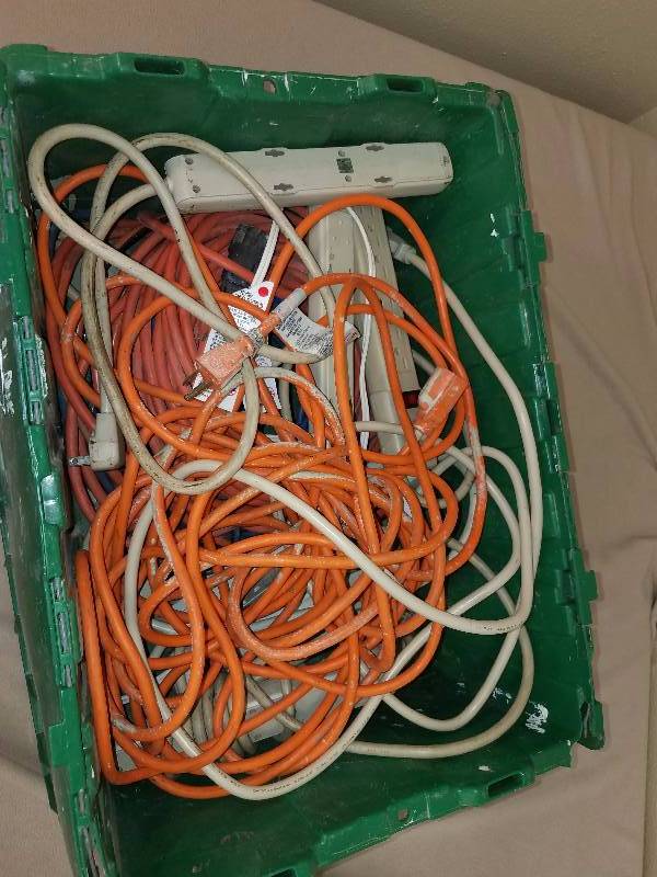 Tote Filled With Cords and Power Strips