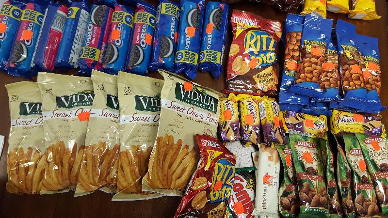 Mixed lot of candy, chips, nuts, gum, and cookies.