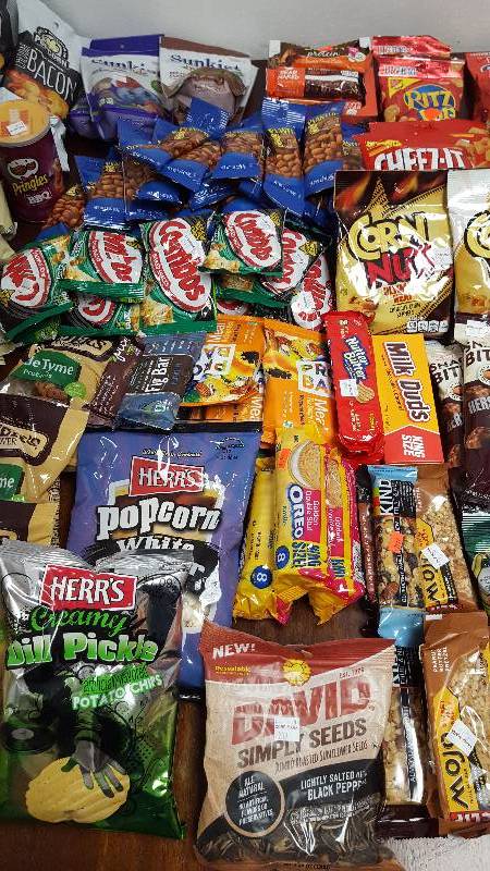 Mixed lot of candy, chips, nuts, gum, and cookies.