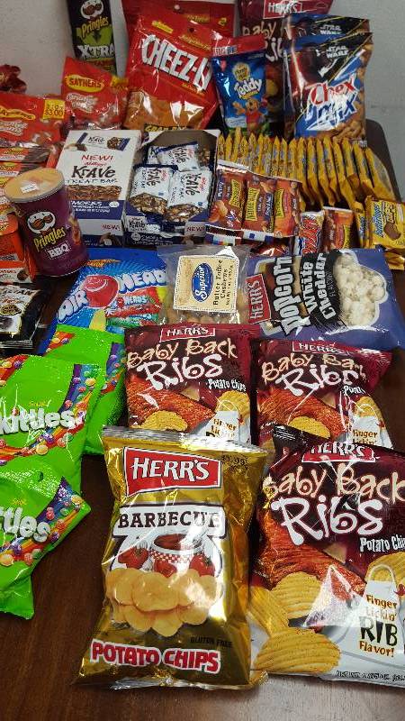 Mixed lot of candy, chips, nuts, gum, and cookies.