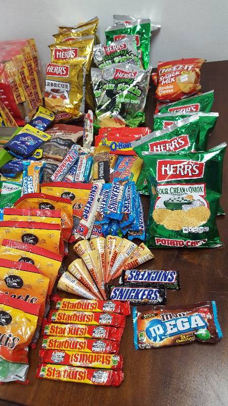Mixed lot of candy, chips, nuts, gum, and cookies.