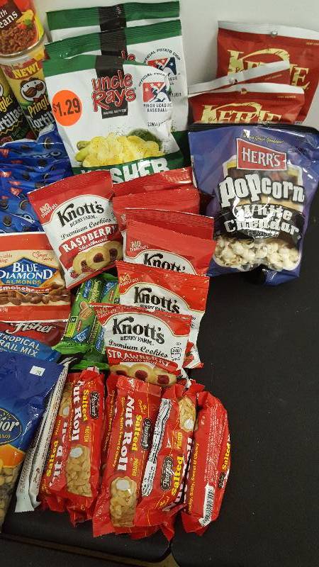 Mixed lot of candy, chips, nuts, gum, and cookies.