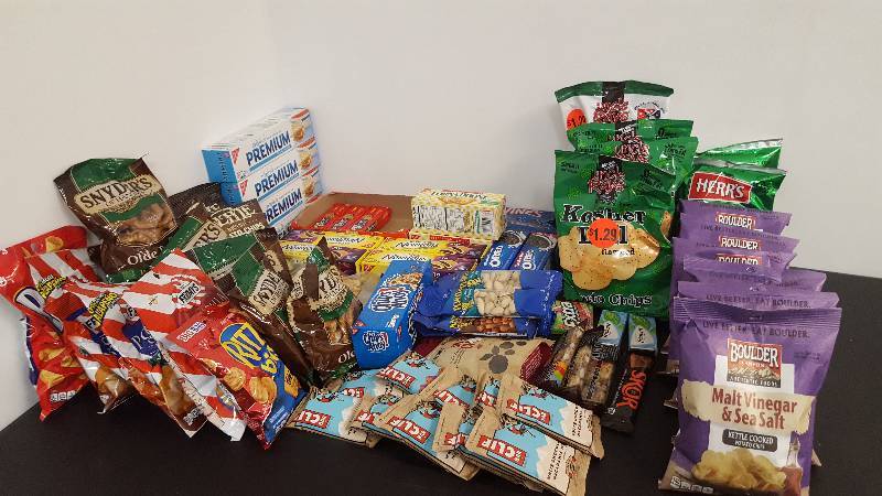 Mixed lot of candy, chips, nuts, gum, and cookies.