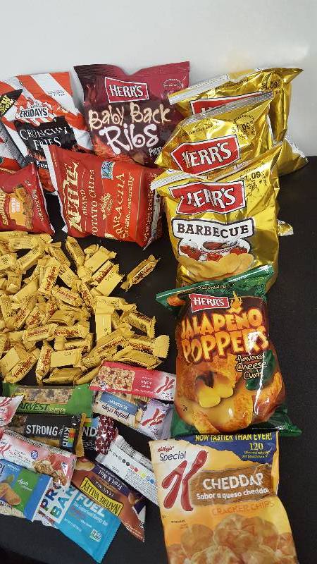 Mixed lot of candy, chips, nuts, gum, and cookies.