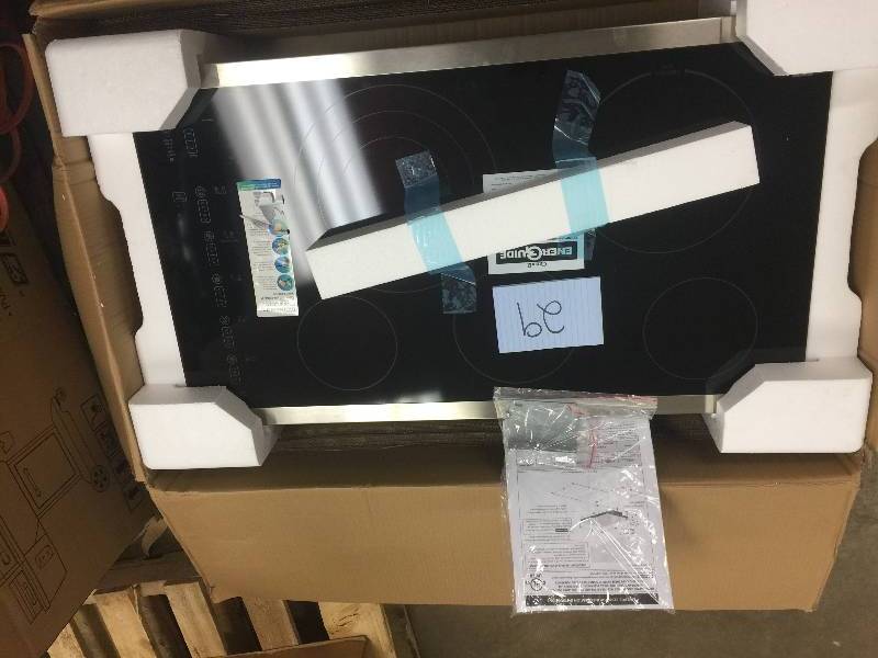 lot 29 image: Kenmore 36 Electric Cooktop with Radiant Elements - Stainless Steel open box never used
