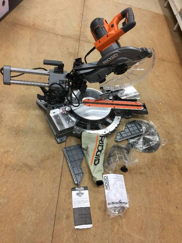 lot 80 image: RIDGID 15 Amp 12 in. Corded Dual Bevel Sliding Miter Saw with 70 Degree Miter Capacity Model#  R4221  open box never used