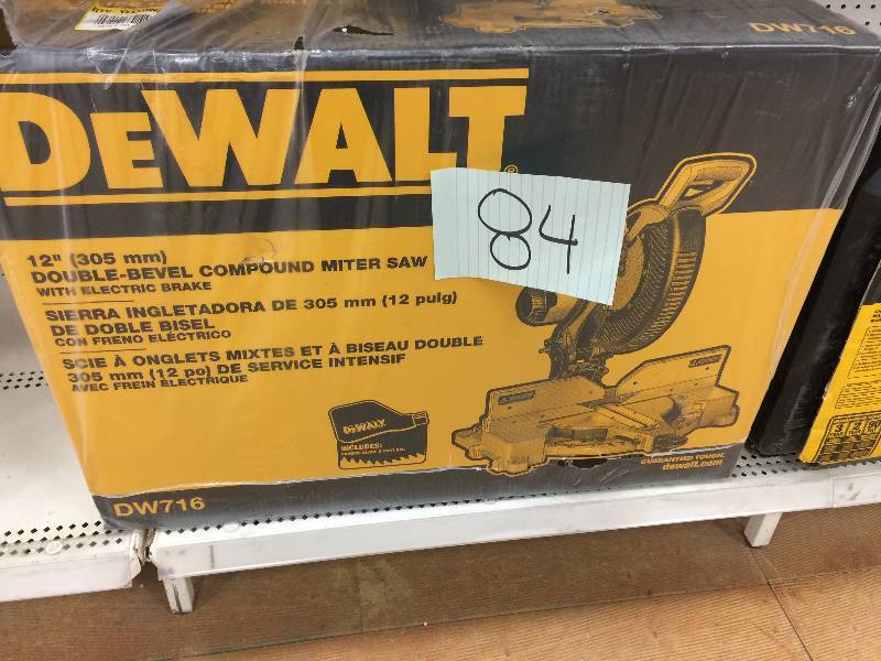 lot 84 image: DeWalt DW716 12 Double Bevel Compound Miter Saw New