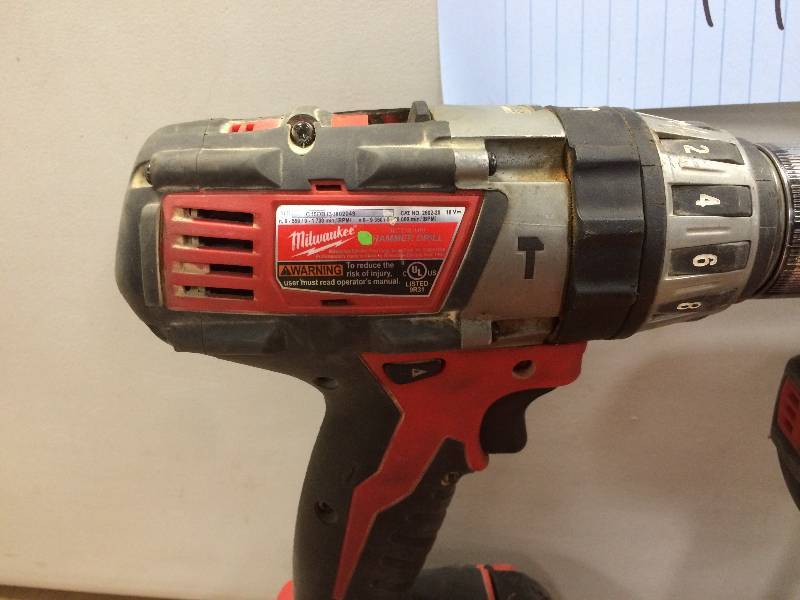 Milwaukee M18 2-Tool Combo Kit includes the 12 Hammer Drill Driver (2602-20) and the 14 Inch Hex Compact Impact Driver (2656-20) used in good condition