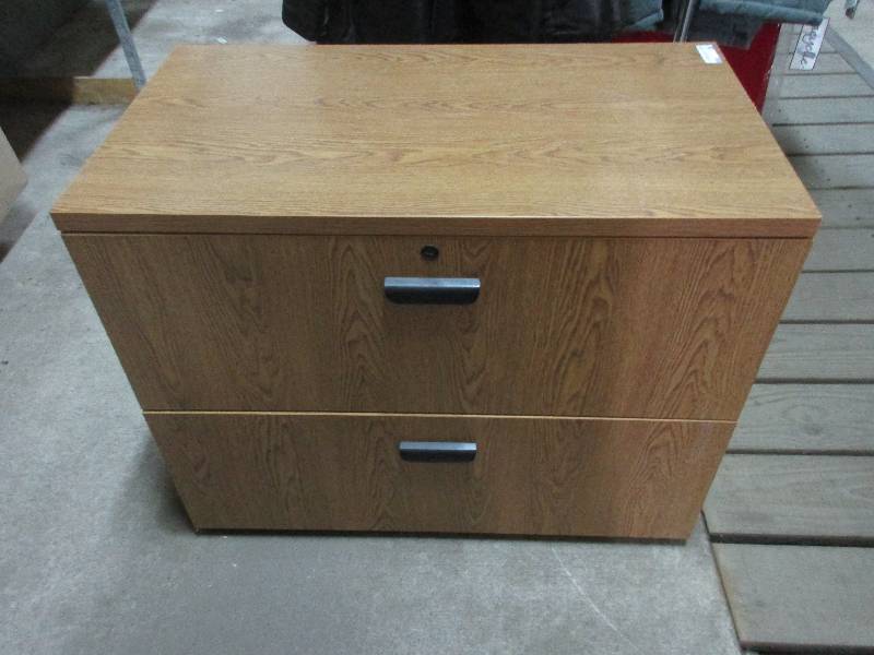heavy duty wood cabinet, Coleman cooler, GM parts books, lights, and blinds
