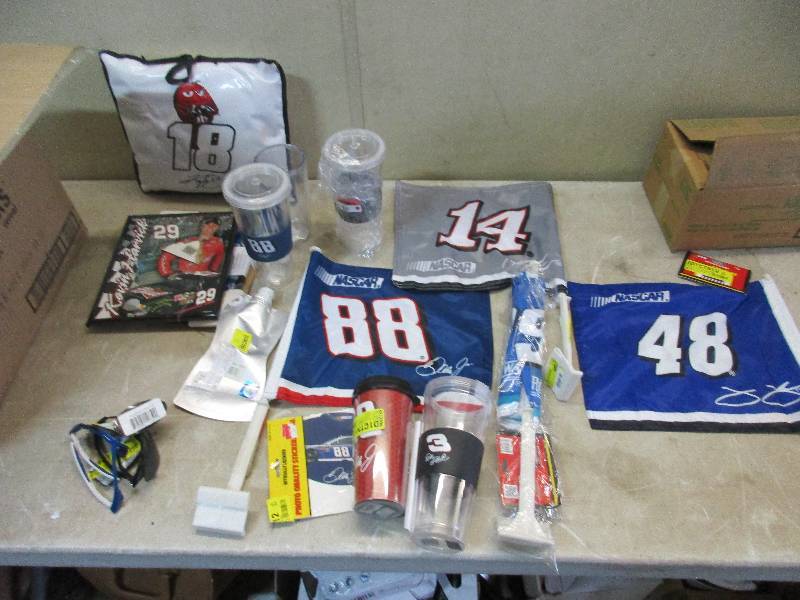 box full of NASCAR memorabilia - flags, cups, stickers