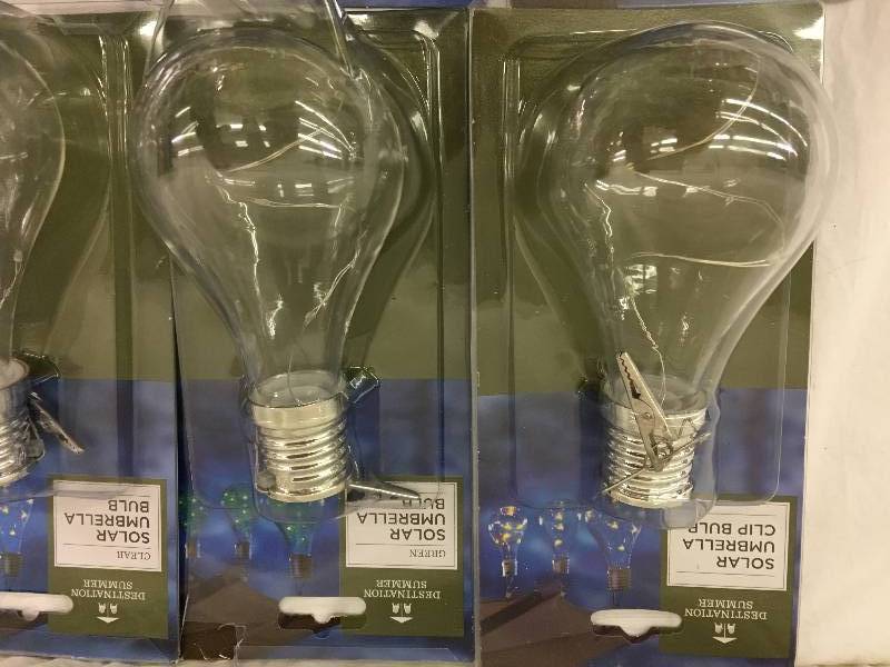 lot 54 image: 9 Solar Light Bulb Umbrella Clip Light in Clear