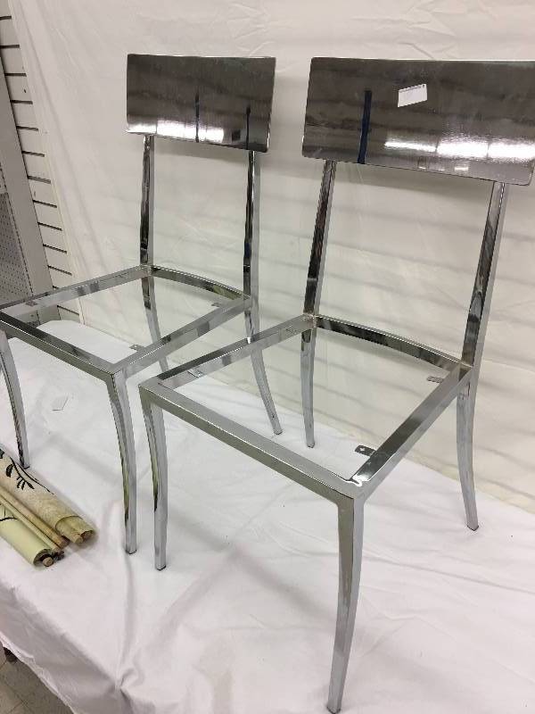 lot 154 image: two chrome chair frames,banners