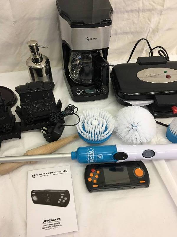 lot 285 image: capresso machine,hurricane scrubber,atari flash back portable,bethany housewares krumkake baker everything shown