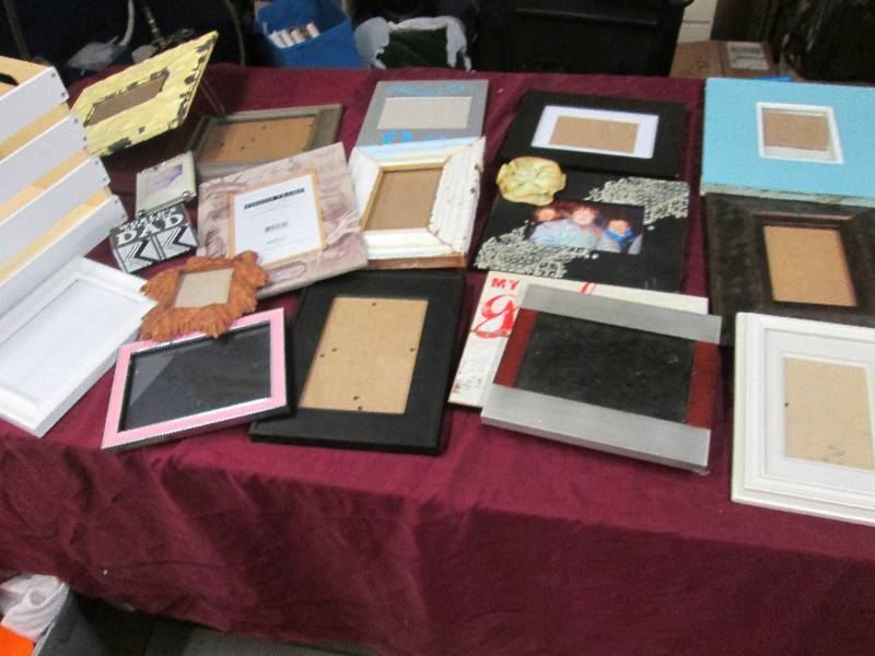 Large Assortment of photo frames in...