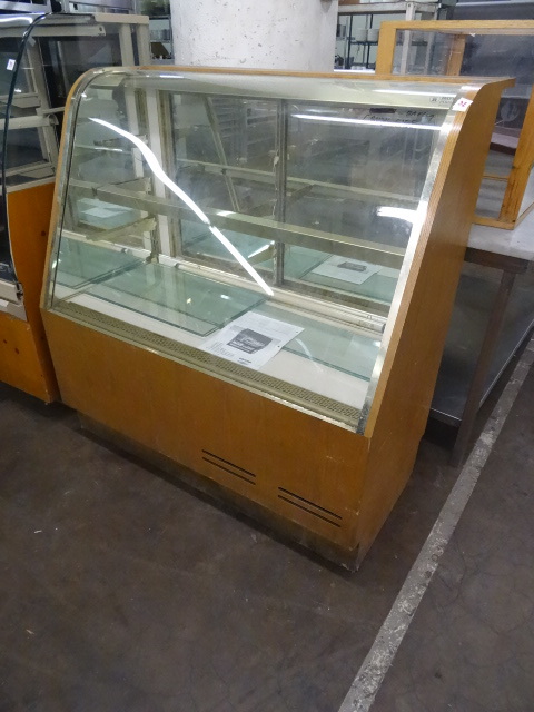 Glass front bakery candy case. Lig...