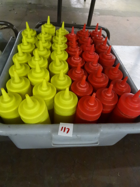 Bin full of ketchup and mustard con...