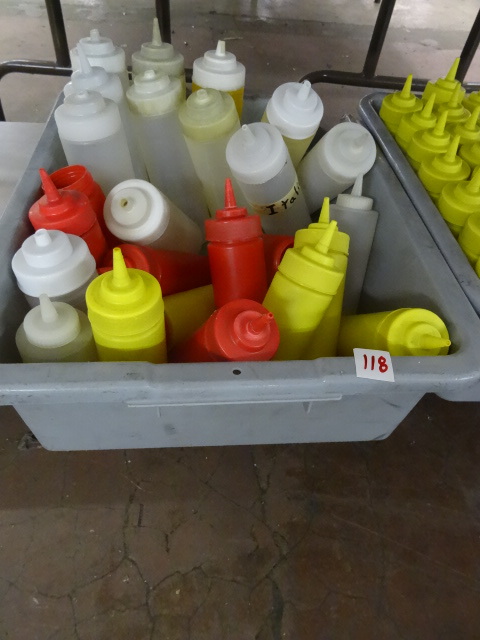 Bin full of ketchup and mustard con...