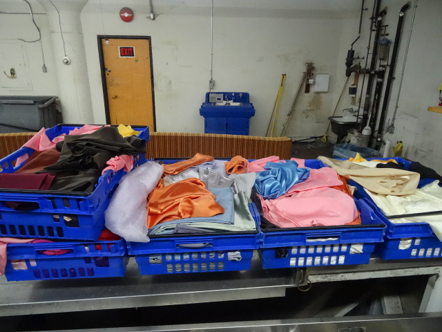 5 totes full of misc fabric pieces....