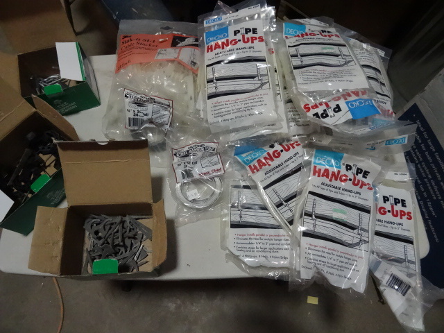 lot 309 image: NEW LARGE LOT Pipe and Electrical Hangers incl 2x Coils 3  4 in Pipe Strap. Est Retail $50