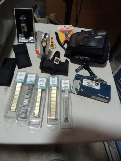 lot 341 image: NEW LOT incl. Samsung Camera, 3x Timex Watches, Multi-tool, 5x watch bands, key rings and more