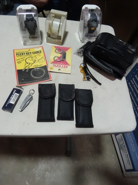 lot 342 image: NEW LOT incl. Samsung Camera, 2x Timex Watches, 1x Lorex Watch, Pocket Knife,  key rings and more