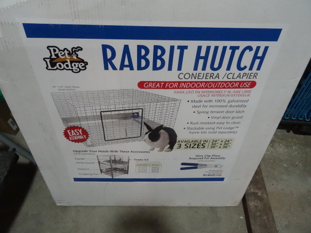 lot 9 image: NEW Pet Lodge Rabbit Hutch Moidel CAH3036 30x36 in. Corner Bent in shipping but should be easily corrected during assembly