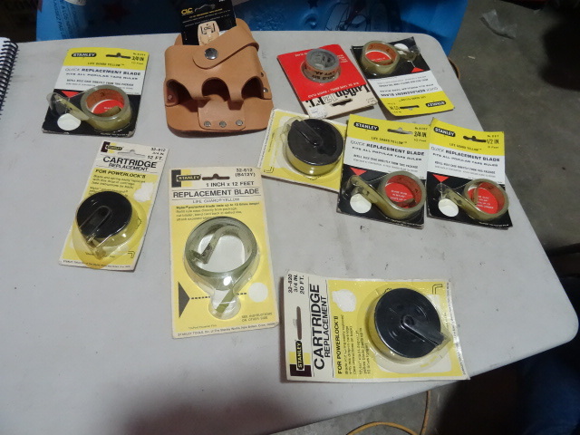lot 189 image: NEW LOT Qty 9 Tape Measure Replacement Blades and a Tape Measure Tool Belt Holder