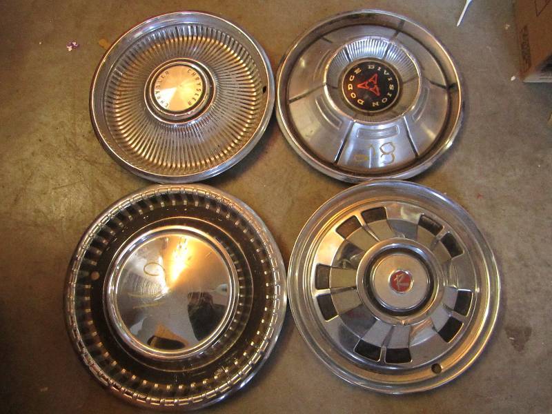 4 Vintage wheel covers...