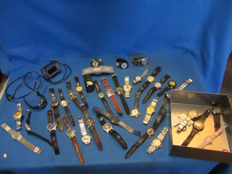 Metal box filled with watches, incl...