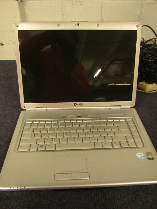 lot 84 image: Dell insparation Turns on...