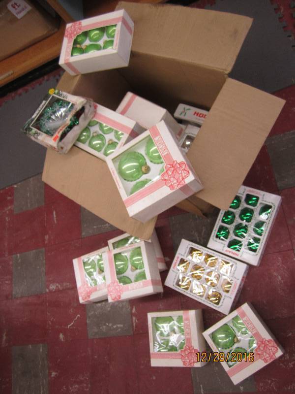 Box filled with vintage new ornamen...