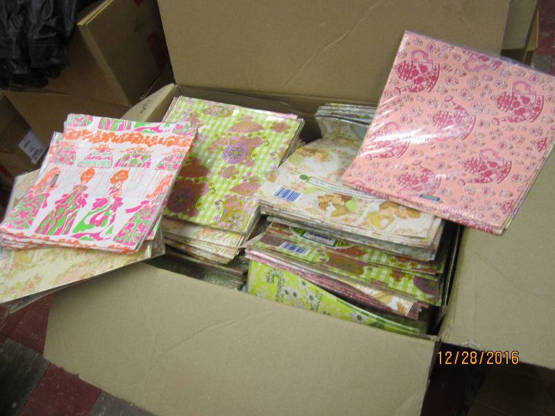 Box filled with many many gift wrap...