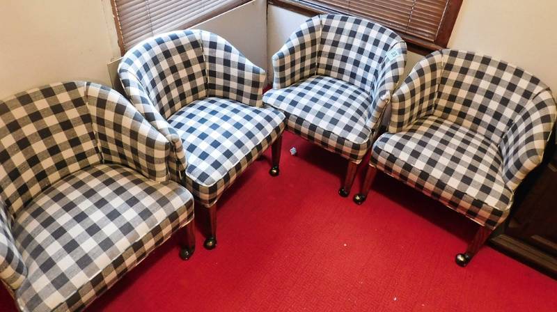 lot 85 image: set of four checkered chairs on wheels