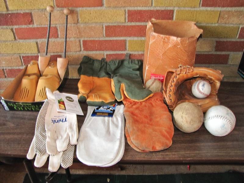 lot 91 image: vintage mittens, shoe trees and ball glove