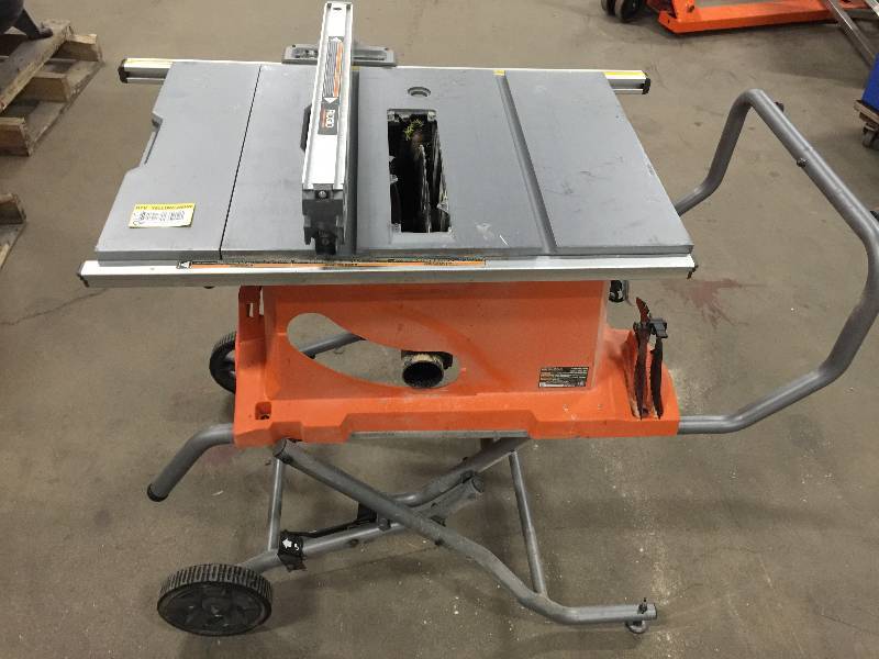 lot 128 image: RIDGID 15 Amp 10 in. Heavy-Duty Portable Table Saw with Stand  used in working conditions