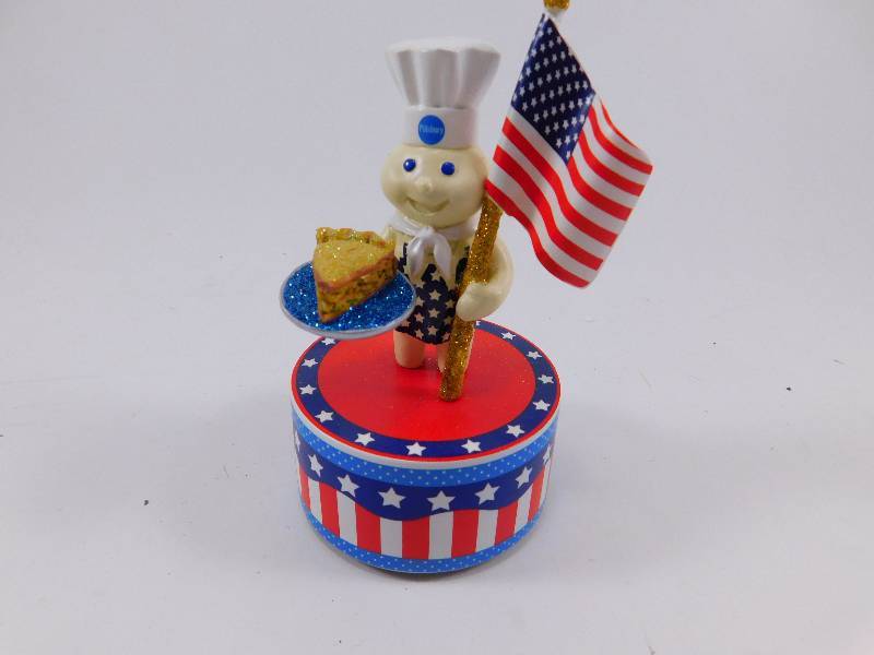 lot 62 image: Pillsbury Doughboy Music Box Figurine