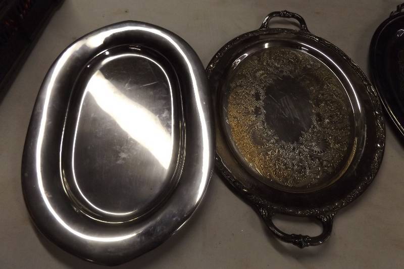 Tub of kitchendcor items and silver plate serving pieces.