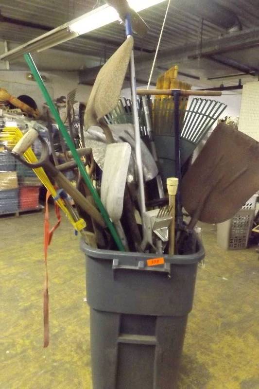 Trash Can full of yard tools