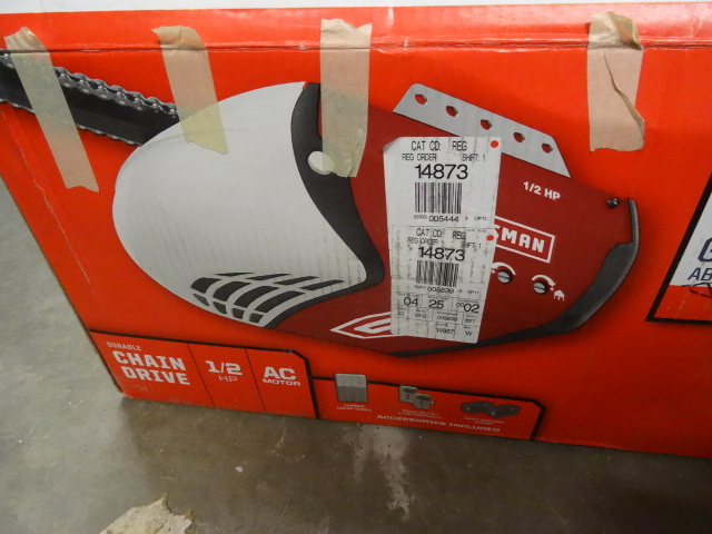 lot 7 image: Craftsman Garage Door Opener 953930 1  2 HP Chain Drive. APPEARS NEW IN BOX AND UNINSTALLED, BOX MARKED DEFECTIVE