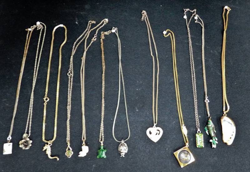 12 necklaces each with a pendant