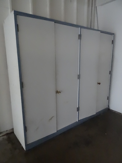 lot 79 image: 4 door wood cabinet. 101 x 25 x 85....
