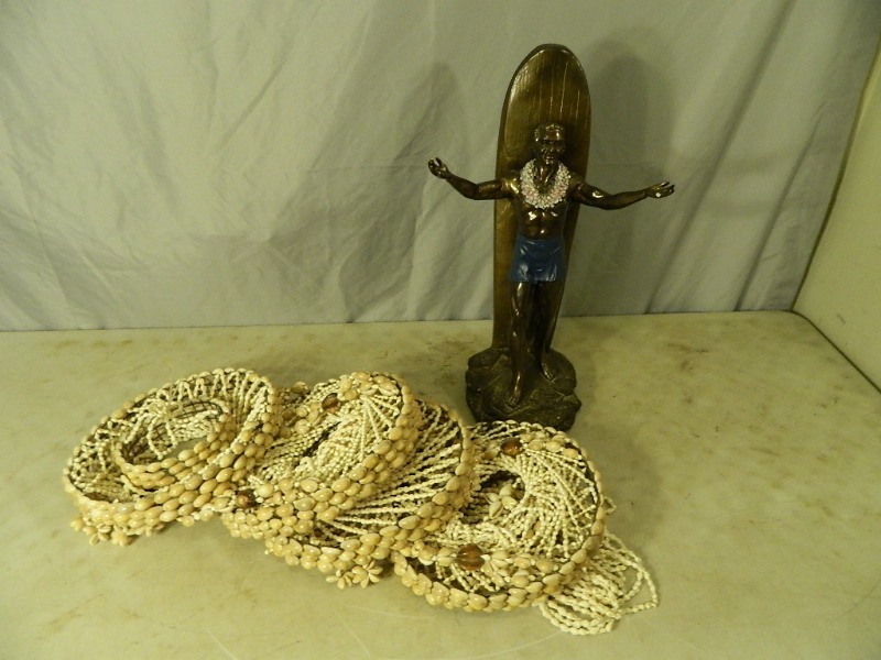 lot 16 image: Surfer Statue and Shell Hanging Decoration