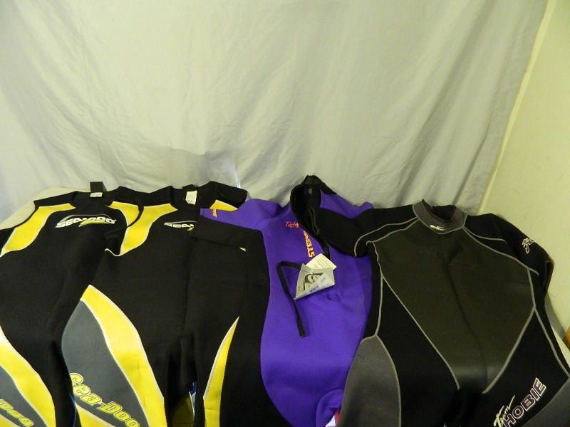 lot 99 image: 4 Wetsuits