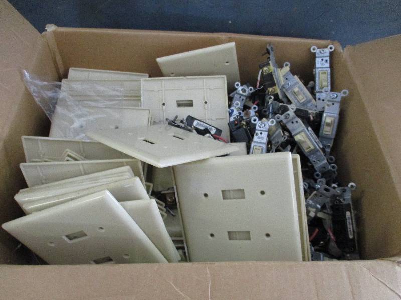 lot 73 image: Box Full Of Light Switches & Covers