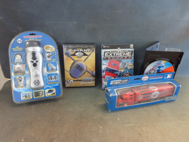 lot 145 image: Die Cast Twins Tractor Trailer, PC Games & Flashlight