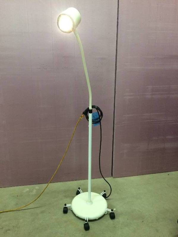 lot 30 image: Retails Used $300 McKesson Mobile Halogen Exam Lamp With Rolling Stand 81-016110 HALOGEN 35 Medical Clinic Exam Light Great For The Garage or Mechanics Light Crafters Photographers Too