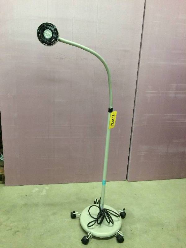 lot 39 image: Retails Used $300 McKesson Mobile Halogen Exam Lamp With Rolling Stand 81-016110 HALOGEN 35 Medical Clinic Exam Light Great For The Garage or Mechanics Light Crafters Photographers Too
