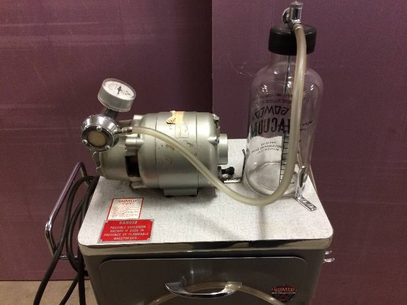 lot 71 image: Excellent Working Condition Gomco Model #790 Medical Grade Surgical Suction Vacuum Pump With Motor On Stainless Mobile Rolling Stand With Drawer