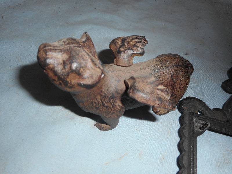 ANTIQUE CAST IRON WINGED CAT AND TRIVET